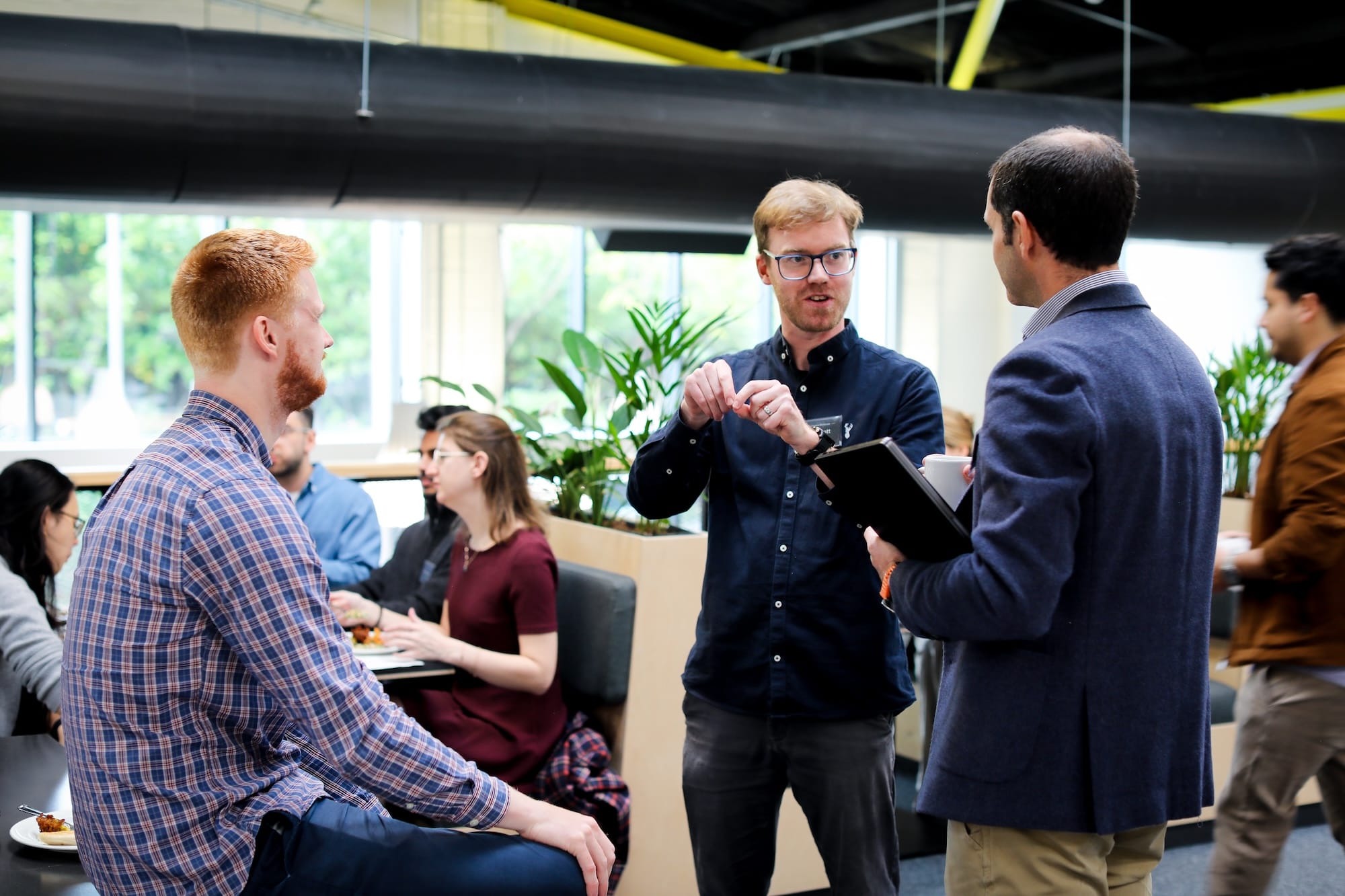 Members of the Accelerator 2.0 cohort in conversation during a session